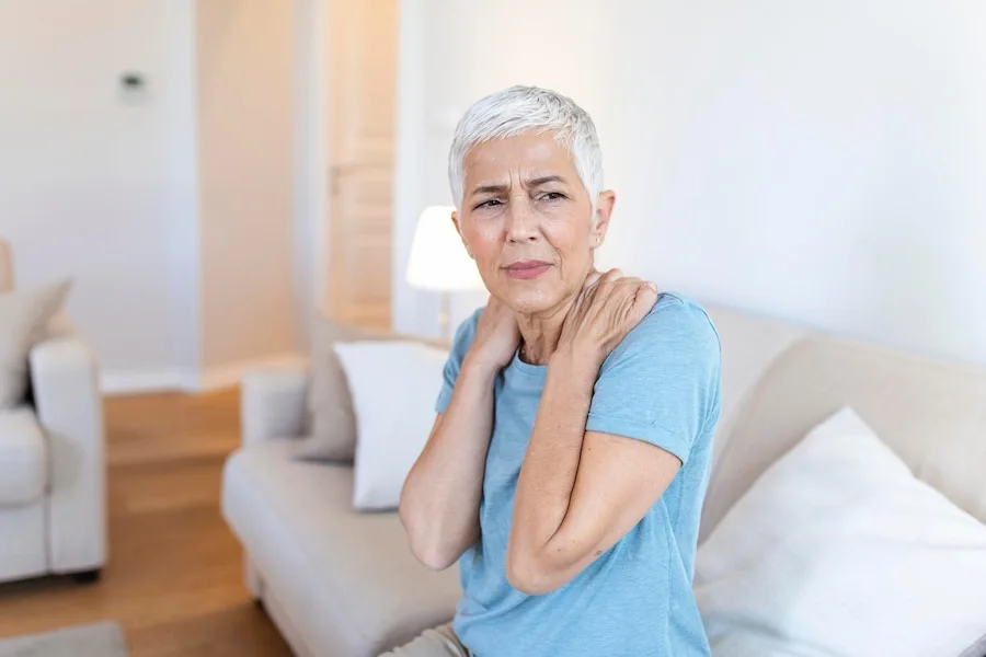 Chiropractor Springfield Illinois senior woman with shoulder pain elderly woman is enduring awful ache shoulder pain elderly person senior lady with shoulder pain